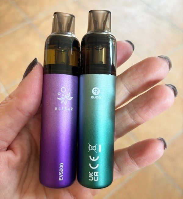 EV5000 Spearmint and Blue Razz Lemonade devices held in a hand