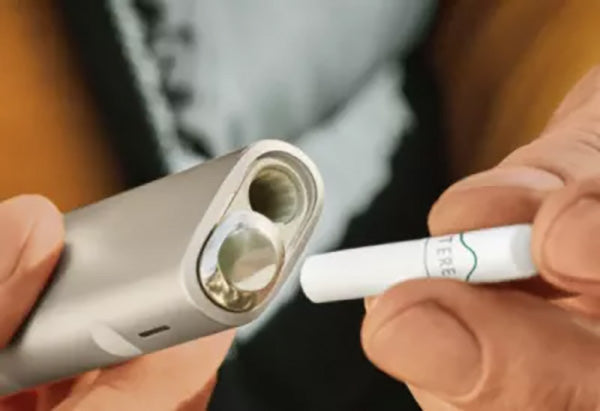 Inserting a Terea Stick into the Iluma One device