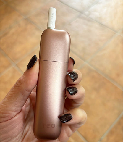 The Neafs TEO device held in a hand